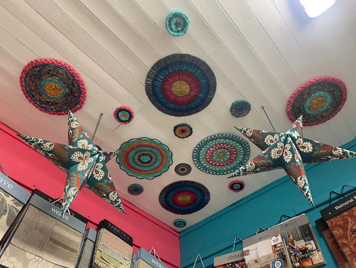 paper ornaments hung on a ceiling